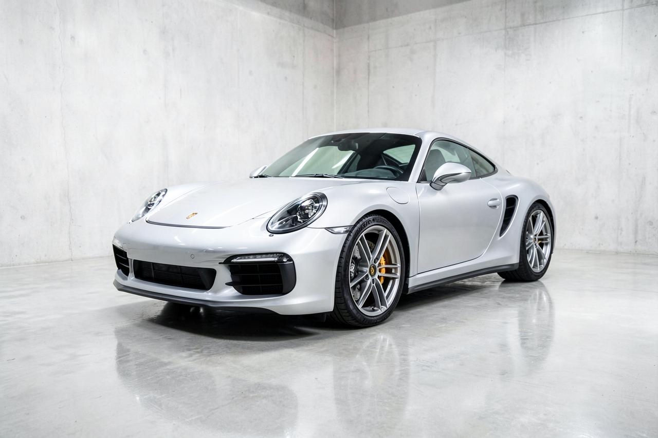 Silver 2022 Porsche 911 Carrera S coupe, front three-quarter view