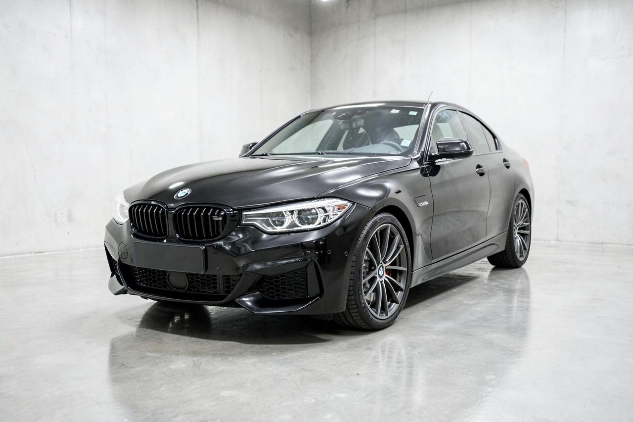 Black 2022 BMW M4 Competition, front three-quarter view