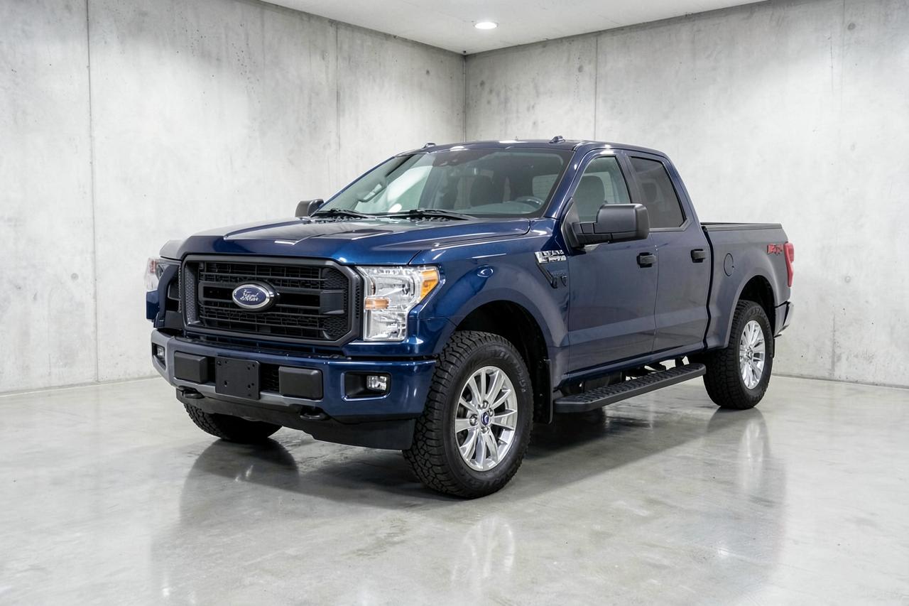 Blue 2021 Ford F-150 Lariat crew cab pickup, front three-quarter view