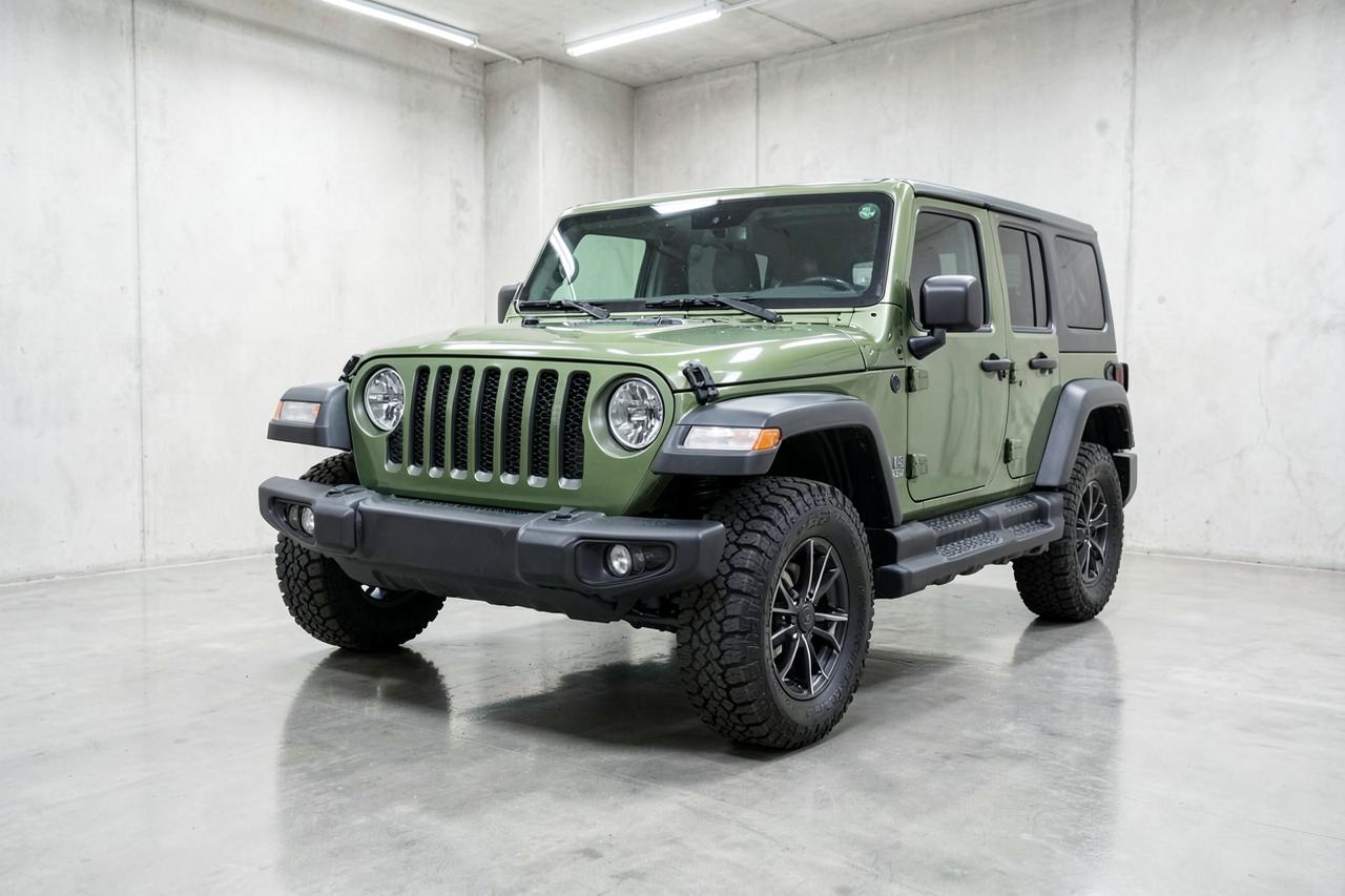 Green 2023 Jeep Wrangler Rubicon four-door, front three-quarter view